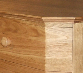 Angled corner on oak chest of drawers